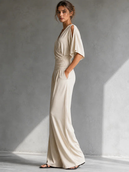 Elegante mono con efecto cruzado y pernera ancha