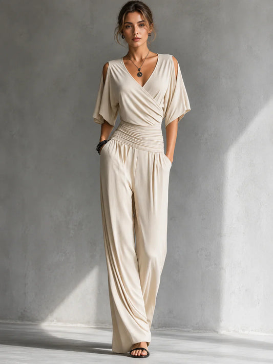 Elegante mono con efecto cruzado y pernera ancha