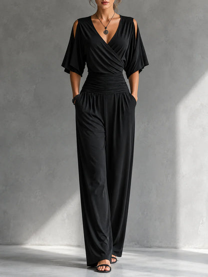 Elegante mono con efecto cruzado y pernera ancha